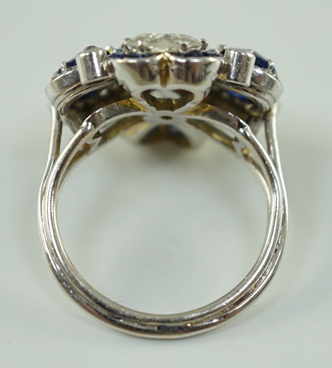 An attractive 18ct white gold, two stone heart shaped diamond and two stone heart shaped sapphire set cluster ring